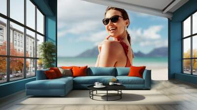 Smiling tourist woman on vacation Wall mural