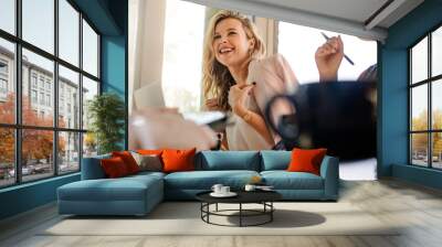 Smiling woman in meeting with colleagues Wall mural