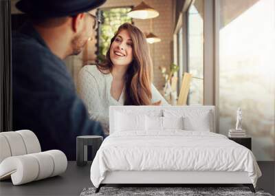 Smiling young woman at cafe with her boyfriend Wall mural