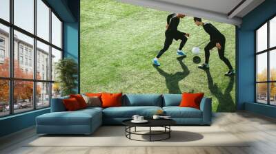 Soccer players in action on field Wall mural