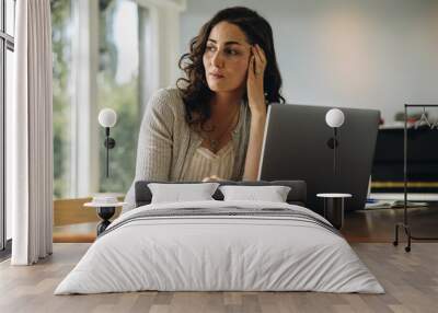 Stressed woman taking break from work at home Wall mural