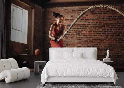 Strong woman working on her strength Wall mural