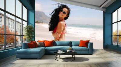 Stylish woman on the beach Wall mural