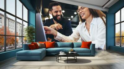 successful businesspeople smiling while working together Wall mural