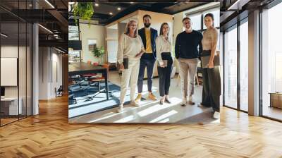 team of businesspeople standing together in an office Wall mural