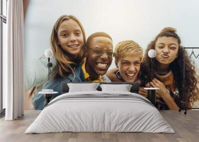 Teenage friends having fun taking a selfie Wall mural