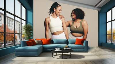 Together in fitness: Two young athletes embracing a healthy lifestyle Wall mural