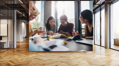 University students doing group study in library Wall mural