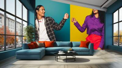 Vibrant team celebration with colorful fist bumps in studio Wall mural