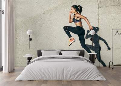 Woman doing fitness exercise outdoors Wall mural