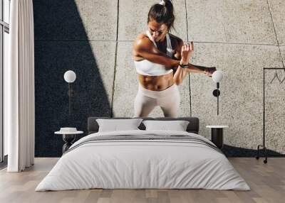 Woman doing warmup workout Wall mural