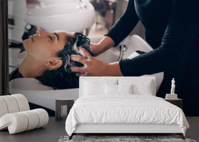 woman getting hair shampooed at salon Wall mural