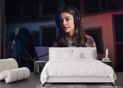 Woman recording a song in music studio Wall mural