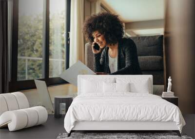 Woman working from her living room Wall mural