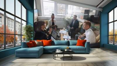 Young business colleagues meeting in modern office Wall mural