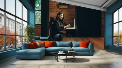 Young businesswoman having a virtual meeting in a coworking space Wall mural