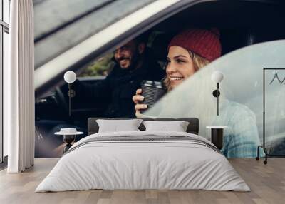 Young couple on road trip Wall mural