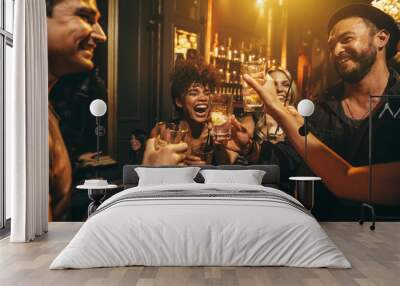 Young men and women enjoying a party Wall mural