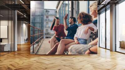 Young people enjoying in terrace Wall mural