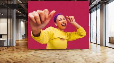 Young woman dancing to her favourite song Wall mural