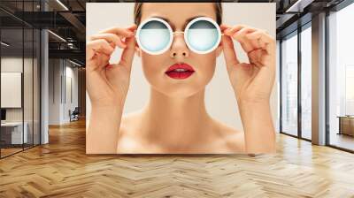 Young woman in sunglasses and red lips Wall mural