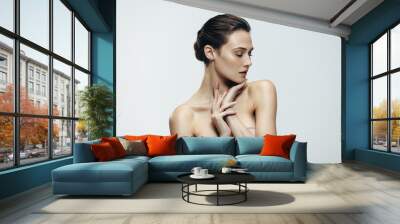 Young woman with glowing skin Wall mural