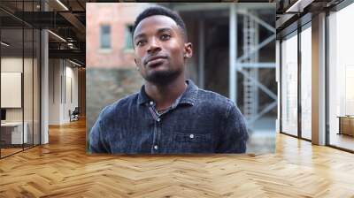 happy young man wondering thinging thoughtful pensive looking guy Wall mural