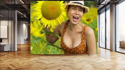 Asian Woman 40s LGBT transgender express feeling Happy Smile fun under sunshine in Sunflower yellow Wall mural