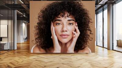 Woman, hands on face and afro hair care for beauty wellness in studio. Skincare dermatology wellness, African girl model portrait and cosmetics makeup headshot for healthy natural skin or facial care Wall mural