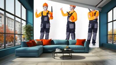 Senior Asian Man wear Orange uniform shirt hat as air condition cleaner washer with blower Wall mural