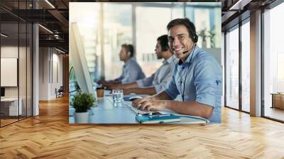 Customer service, coworking space and portrait of happy man consulting with advice and smile at help desk. Phone call, conversation and happiness, callcenter consultant typing at computer in office. Wall mural