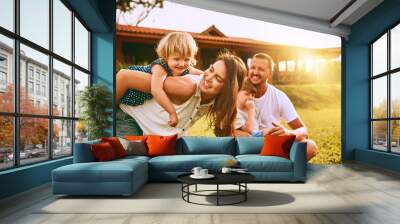 Appreciate these moments. Cropped shot of a young family spending time together outdoors. Wall mural