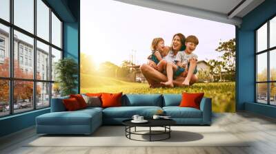 Her boys fill her life with joy. Cropped shot of a young family spending time together outdoors. Wall mural