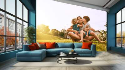 Kiss delivery for mom. Cropped shot of a young family spending time together outdoors. Wall mural