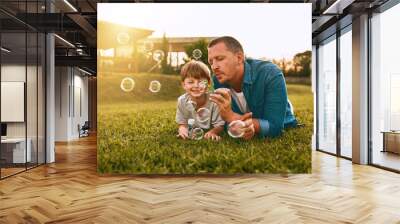 Nothing grows a father son bond like fun. Cropped shot of a young family spending time together outdoors. Wall mural