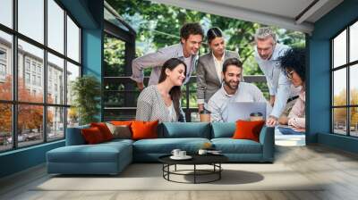 Sometimes a change in scenery is just whats needed. Cropped shot of a group of business colleagues having a meeting outdoors at a cafe. Wall mural