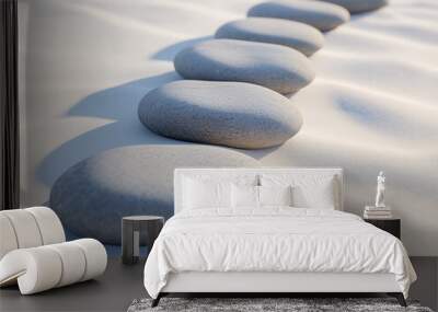 Smooth stones arranged in a zen formation on white sand beach. medication and peaceful concept.  Wall mural