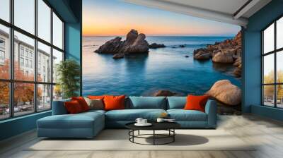 rocks in sea at sunset sardinia italy Wall mural