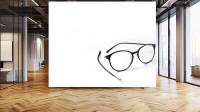 Old glasses on broken legs on white background,selective focus Wall mural