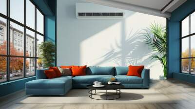 Air conditioning unit on a wall with green indoor plant. Concept of home cooling, climate control, indoor comfort, modern interior. Copy space Wall mural