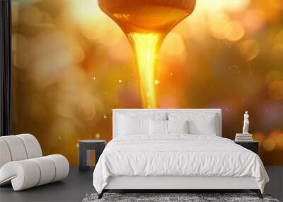 Golden honey dripping from a dipper against a blurred floral background with bokeh lights. Concept of organic sweetness, natural foods, wholesome produce. Wide Banner. Copy space Wall mural