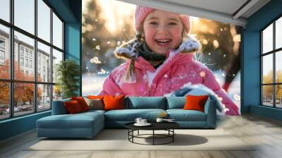 Joyful Young Caucasian Girl Playing with a Soccer Ball in the Snow During Winter. Concept of Childhood Fun, Outdoor Play, Winter Activities Wall mural