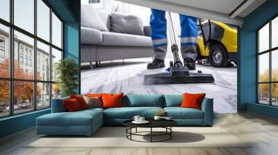 Professional cleaning service using a high-powered vacuum cleaner on a carpet in a modern home setting. Commercial cleaning equipment in use for domestic upkeep. Home cleaning and maintenance concept Wall mural