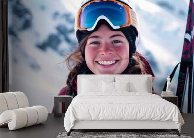 Young Smiling Woman Wearing Ski Gear with Mountain Background. Concept of Winter Sport, Outdoor Adventure, Skiing. Copy space Wall mural