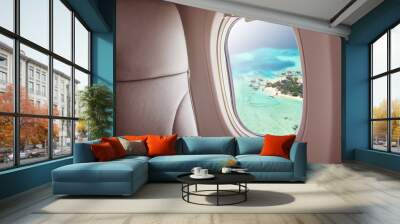 Airplane window with beautiful Maldives island view Wall mural