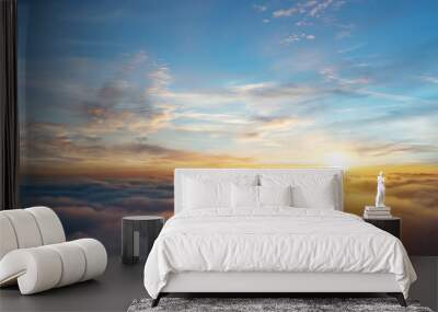 Beautiful aerial view above clouds with sunset Wall mural