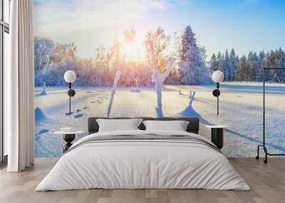 Beautiful snowy landscape panorama with forest on background Wall mural