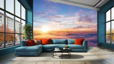 Beautiful sunset sky above clouds Wall mural