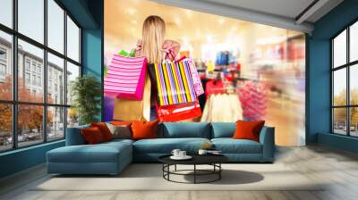 blond woman with shopping bags Wall mural