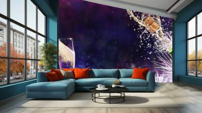 bottle of champagne with glasses over fireworks background Wall mural